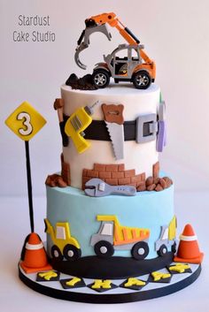 a construction themed birthday cake is on display