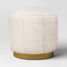 a white stool with gold trim around it