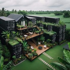 an aerial view of a building with plants growing on the balconies