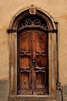 an old wooden door in front of a building