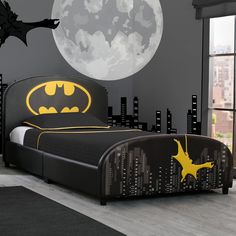 a batman themed bedroom with the moon in the background