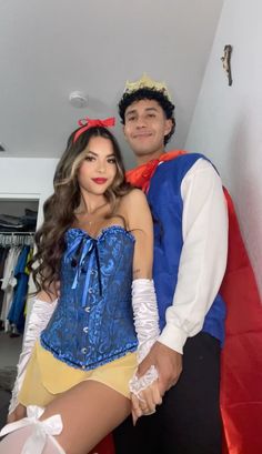 a man and woman dressed up in costumes