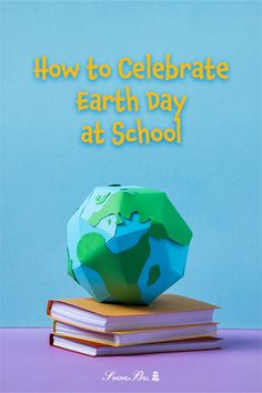 an earth globe sitting on top of books with the words how to celebrate earth day at school