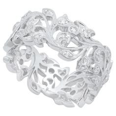 a white gold and diamond ring with leaves on the side, set in 18k white gold