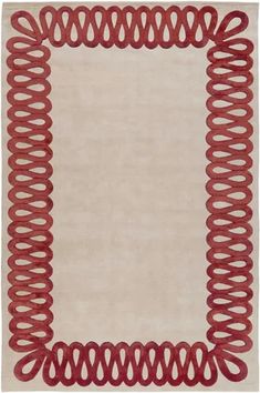 a white rug with red spirals on it