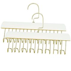 two white hangers with gold hooks on them