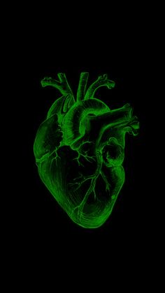 an image of a green heart in the dark