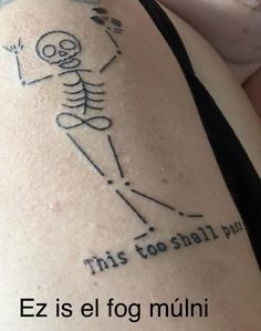 a person with a skeleton tattoo on their arm