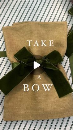 a bag with a bow on it that says take a bow