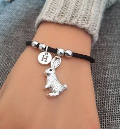 Rabbit Bracelet, Bunny Bracelet, Rabbit Bracelet Women , Rabbit Gift, Rabbit Jewellery, Rabbit Gifts for Her, Rabbit Friendship, Personalised Rabbit , Rabbit Charm, Gift for Her Bracelet Women  The bracelet is approx 17cm and an additional chain of 4cm to extend. Rabbit  charm is approx 2.7cm For Similar products :  https://www.etsy.com/uk/shop/YouLoveYouShop?ref=hdr_shop_menu&section_id=16711668 For Extra initials or customization please message me directly I am happy to help.  Photo might be S Silver Friendship Bracelets Gift, Handmade Adjustable Charm Bracelet For Personalized Gift, Handmade Adjustable Charm Bracelet For Gift, Handmade Adjustable Wristband For Personalized Gift, Silver Wristlet Bracelet For Gift, Silver Bangle Wristlet As Gift, Adjustable Bracelet Strap Wristlet For Gift, Adjustable Braided Bracelet With Charms For Gift, Rabbit Bracelet