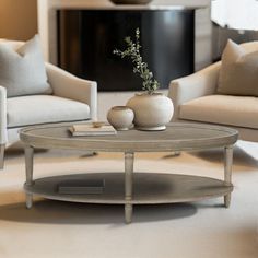 a living room with two couches and a coffee table in the middle, surrounded by pillows