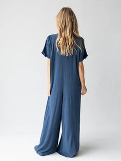 It's comfy and oversized fit! Solid Color Relaxed Fit Jumpsuit For Leisure, Baggy Cotton Jumpsuits And Rompers For Leisure, Casual V-neck Jumpsuit With Relaxed Fit, Comfortable Relaxed Fit Overalls, Comfortable Overall Jumpsuits And Rompers For Loungewear, Relaxed Fit Jumpsuits And Rompers For Loungewear, Comfortable Jumpsuits And Rompers For Loungewear, Solid Color Jumpsuits And Rompers With Pockets For Loungewear, Relaxed Fit Overalls Jumpsuit For Loungewear