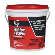 a bucket of plaster that is red and white with the words paster of paris on it