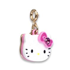 a hello kitty keychain with a pink bow on it's back end