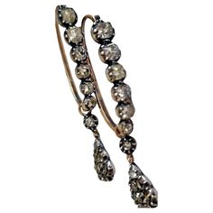 MAGNIFICENT PAIR OF GEORGIAN POISSARDE DIAMOND EARRINGS, Diamonds bright and lively. Extremely rare to find a pair of diamond poissarde earrings like this. Antique Pair of Early 19th Century Old Mine Cut Diamond Dangle Drop Hoop Earrings. Antique amazing pair Dangle Drop Hoop (Poissarde) Earrings Old Cut Diamonds total approx. 4.20 carats, with two separate detachable bodies. Mounted in silver over 18 Karat Gold- Total weight: 6.89gr. Length hoop 3cm and the drop 1.90 cm. Total length 4.90cm app Georgian England, Drop Hoop Earrings, Earrings Antique, Regency Era, Antique Earrings, Jewelry Earrings Hoops, Rare Antique, 19th Century, Diamond Earrings