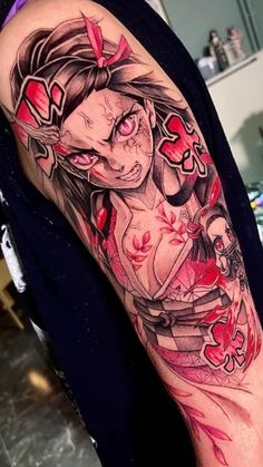 a woman's arm with tattoos on it and an image of a demon in the background