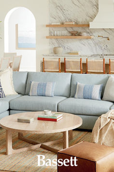 image of a blue living room L Shaped Sectional, L Shaped Couch Living Room Overstock, Kid Friendly Couch, Cali Modular Sectional, Modular Sectional Sofa Seperated, Altari 2-piece Sectional With Chaise, Harmony Modular 3-piece Chaise Sectional, Round Cocktail Tables, Bassett Furniture