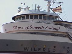 the top of a boat with a sign on it that says 50 years of smooth sailing