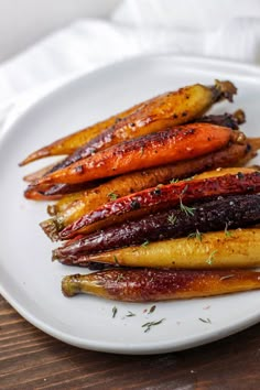 carrots with herbs on a white plate