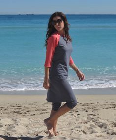 Modest swim and activewear. Grey top with 3/4 coral sleeves and grey swim skirt with attached capri underneath. Modest Swimwear Christian, Culotte Pattern, Conservative Swimwear, Modesty Christian, Long Swim Skirt, Swimsuit Modest, Swim Outfit, Swimwear Long, Apostolic Style