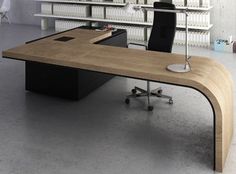 an office desk with a chair in front of it