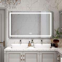 a bathroom with two sinks and a large mirror