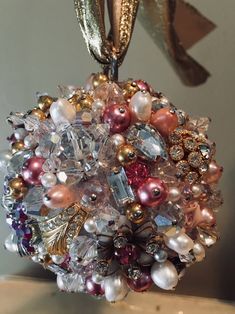 an ornament made out of glass beads and pearls