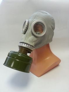 a gas mask on top of a plastic head