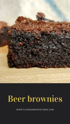 a piece of brownie sitting on top of a wooden cutting board with the words beer brownies