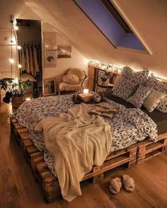 a bed made out of wooden pallets in a loft