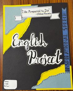 an english project book sitting on top of a wooden table