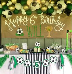 a soccer themed birthday party with balloons and decorations