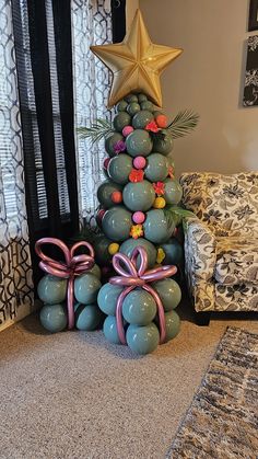 a christmas tree made out of balloons and bows