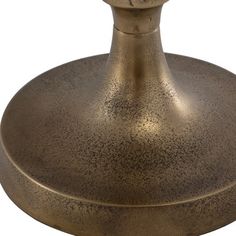 an antique brass finish table lamp on a white background