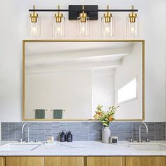 a bathroom with two sinks and a large mirror