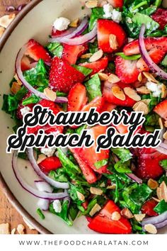 strawberry spinach salad in a white bowl with the words, strawberry spinach salad