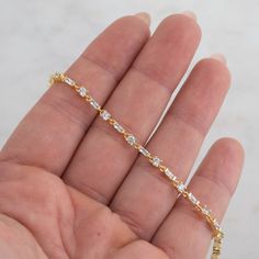 "Beautiful and unique design featuring alternating baguette and round solitaire stones. Looks great stacked or on its own! - - - D E T A I L S  - - - * Made of 925 Sterling Silver * THICK plating of 14k Gold or Rhodium  * Available in 6.25\" or 6.75\" + .5\" Extension  * Lobster Clasp Closure  * Nickel-free & Hypoallergenic  BRACELETS ON MODEL: https://www.etsy.com/listing/1309906134/two-delicate-bracelets-set-dainty?click_key=1e944866e56efac4b5e794680395a203da83fa43%3A1309906134&click_sum=c7db1889&ga_search_query=bracelet&ref=shop_items_search_13&pro=1 Made with 100% Pure Love! ♡ Happy to answer any questions you may have! 🥰 Let's Connect! 🥰 IG: samijewels_" Baguette Bracelet, Custom Birthstone Ring, Bracelet Tennis, Cubic Zirconia Bracelet, Bracelet Diamond, Bracelet Minimalist, Round Solitaire, Minimalist Bracelet, Dainty Bracelets