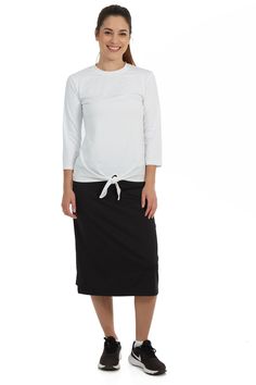 This midi-length Snoga was designed for those gals that are either tall or just want more coverage. This skirt is a soft pencil shape that is not hugging and has above the knee shorts attached to ensure that you are covered while either doing the sport of your choice, traveling, or just running around doing errands. The material is a high performance quick drying fabric that is chlorine safe so it is suitable for water sports. You can add a t-shirt or sweater and this style can take you anywhere Skirts With Sneakers, Above The Knee Shorts, Modest Activewear, Everyday Skirts, Knee Shorts, Athletic Skirts, Modesty Outfits, Ankle Length Leggings, Navy Blazer