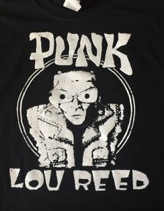 "Lou Reed Shirt Top S/M/L/XL Fitted Adult Gildan 5.3 OZ Shirt/top. I have all sizes in color Black, Red, Green or Royal Blue. preshrunk 100% cotton jersey knit (blended cotton/polyester in antique and heather and neon and safety colors) * 5.3 oz. Measurements : Small 18\" to 19\" From Pit To Pit Medium 19\" to 20\" From Pit To Pit Large 20\" to 21\" From Pit To Pit XLarge 22\" to 24\" From Pit To Pit XXLarge 25\" to 26\" From Pit To Pit Measurements in inches." Punk Style Cotton Crew Neck Top, Punk Cotton Top With Screen Print, Punk Style Tops With Logo Print And Relaxed Fit, Punk Style Relaxed Fit Top With Logo Print, Punk Style Top With Front Print And Relaxed Fit, Punk Style Pre-shrunk Relaxed Fit Tops, Punk Relaxed Fit Pre-shrunk Tops, New York Shirt, Football Game Outfit