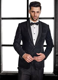 Elevate your formal wardrobe with the exquisite Black Embroidery Velvet Tuxedo Set, a perfect blend of classic elegance and modern flair. Crafted from luxurious velvet, this black jacket showcases intricate thread embroidery and shimmering sequins in a refined herringbone pattern, adding both texture and a subtle shine. Paired with matching black trousers, this ensemble offers a polished and sophisticated look. Ideal for wedding receptions, cocktail events, or sangeet nights, this tuxedo is desi Velvet Tuxedo, Vacuum Storage, Indian Wedding Wear, Black Embroidery, Wedding Receptions, Thread Embroidery, Black Trousers, Herringbone Pattern, Wedding Wear