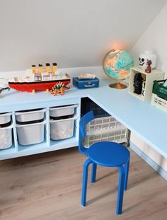 a blue desk and chair in a child's room