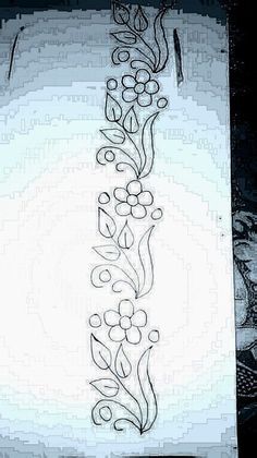 a piece of paper that has been drawn with black ink and some flowers on it