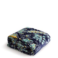 the blue and yellow floral print is folded on top of each other