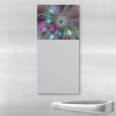 an abstract painting on the wall next to a door handle and a white paper towel dispenser