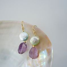 PRODUCT DETAILS: * Earrings made Gemstone * Materials:         +Pearl TFL-12x12 mm      +Amethyst 12x17 mm * Size: 4,5cm * Metal Parts: Silver14K Gold Plated Dainty  * Made in Quang Nam - Viet Nam (handmade) CAUTIONS: Product color in hand may vary from pictures due to the light disparency but the quality is not changed. CUSTOMER SERVICES: We prioritize a fast shipping method Products in hand around 10-18 days Do not hesitate to contact me if you have any dissatisfaction with our services CUSTOM Handmade Amethyst Earrings For Wedding, Handmade Amethyst Wedding Earrings, Natural Stones Drop Earrings For Wedding, Amethyst Drop Earrings For Wedding, Teardrop Amethyst Earrings For Wedding, Bohemian Wedding Earrings With Gemstones, Amethyst Jewelry With Matching Earrings For Wedding, Wedding Teardrop Amethyst Earrings, Wedding Amethyst Jewelry With Matching Earrings