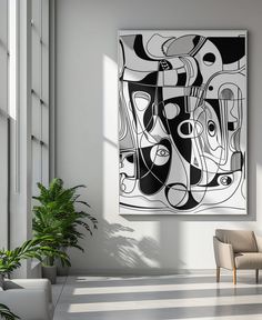 an abstract painting hangs in the corner of a room next to a chair and potted plant