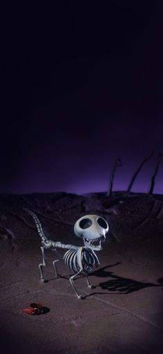 a skeleton is standing in the middle of a desert