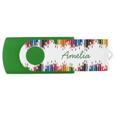 a green and white name tag with colored pencils in the shape of an o