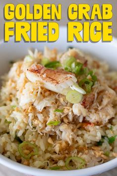 a white bowl filled with fried rice and topped with scallions, green onions and sliced fish