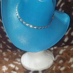 You Are Looking At An Alamo Hat Company Cowboy Hat. It Is Blue With A Blue And White Hat Band With A Gold Trim. The Hat Is Old Stock But New And Unused. Western Blue Sun Hat With Flat Brim, Blue Brimmed Sun Hat For Rodeo, Western Style Blue Sun Hat With Flat Brim, Blue Sun Hat With Curved Brim For Country Events, Wide Brim Blue Sun Hat For Rodeo, Blue Curved Brim Sun Hat For Rodeo, Western Blue Wide Brim Sun Hat, Blue Country Hat With Short Brim, Blue Curved Brim Sun Hat For Country Events